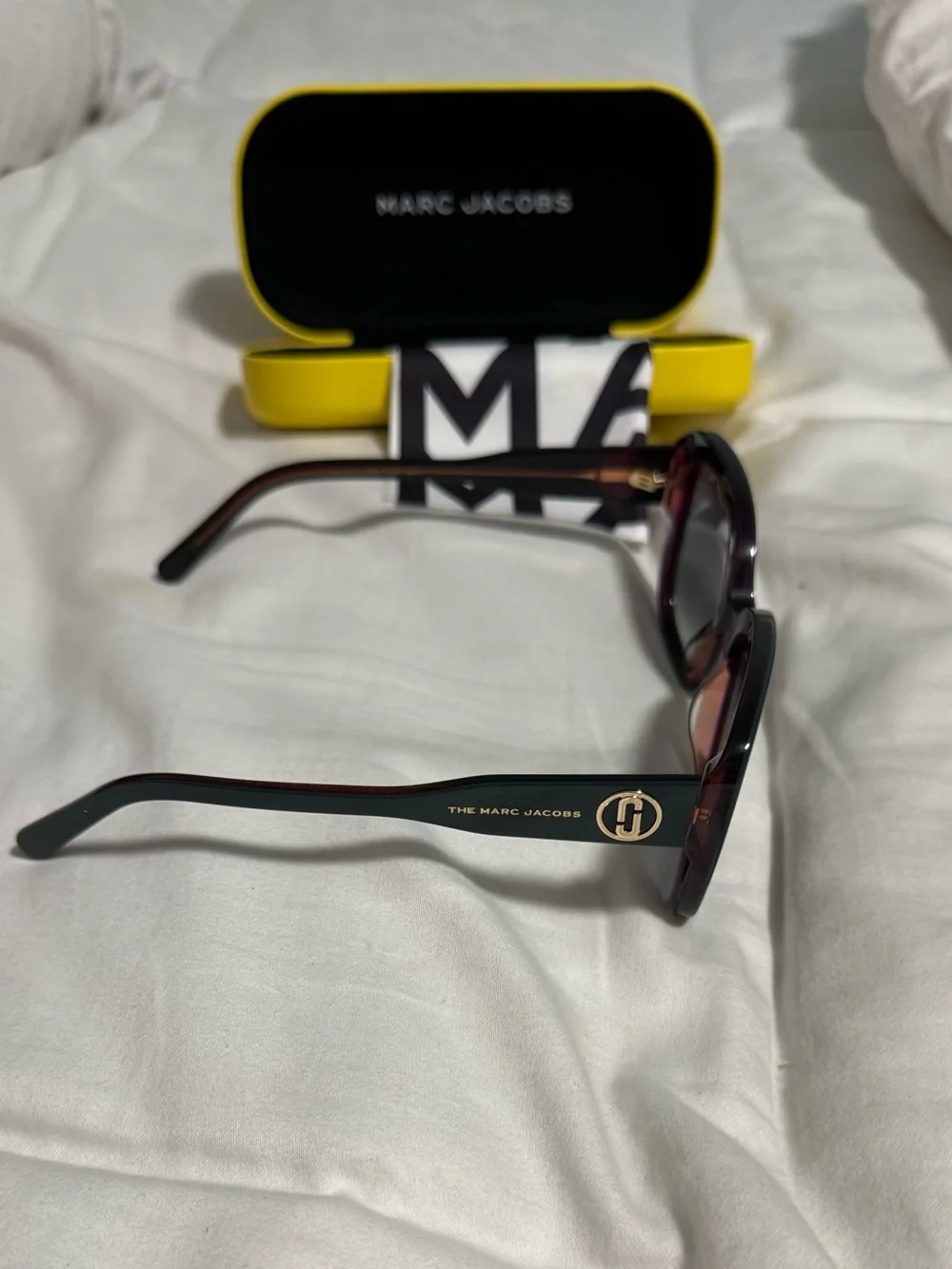 Marc Jacobs Woman’s Dark Teal Square Sunglasses with alternating pink hues! New